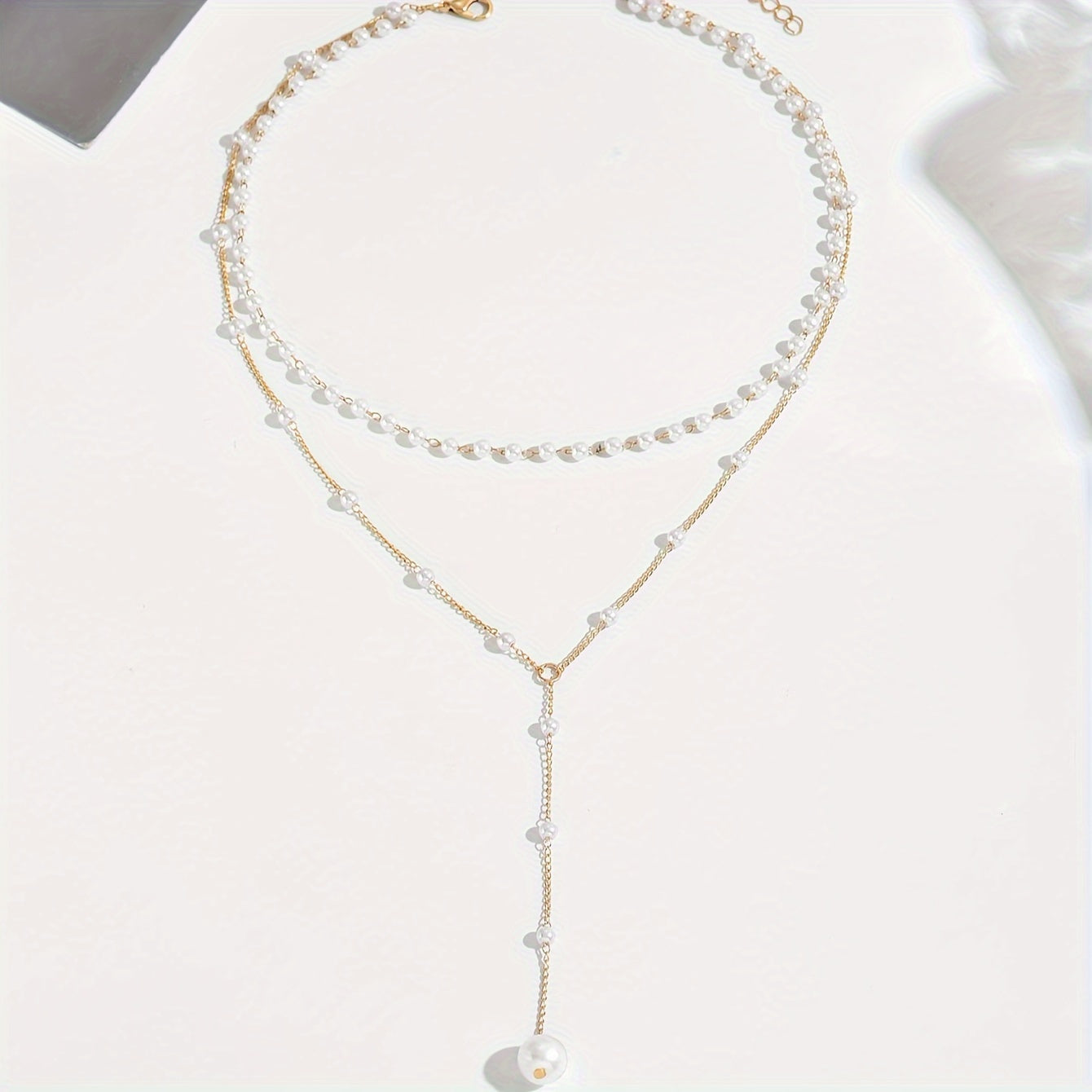 ELENA | Collar de perlas con diseño en Y